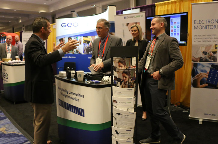 Institute exhibitor with attendee